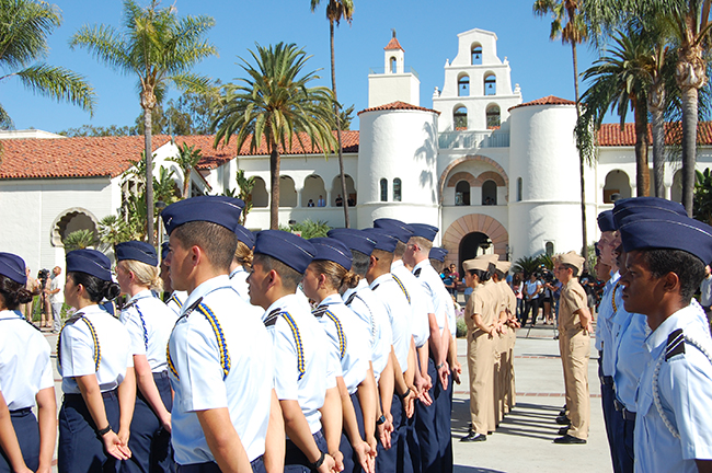 Military members standing at attention at SDSU campus.